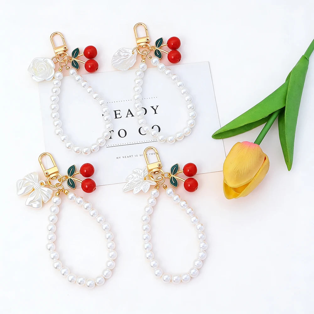 Elegant Imitation Pearl Wrist Phone Lanyard with Cherry Pendant Cute Bow Leaf Keychain Bag Charm Anti-lost Phone Strap for Women