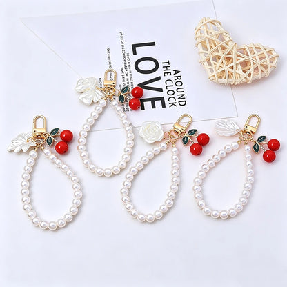 Elegant Imitation Pearl Wrist Phone Lanyard with Cherry Pendant Cute Bow Leaf Keychain Bag Charm Anti-lost Phone Strap for Women