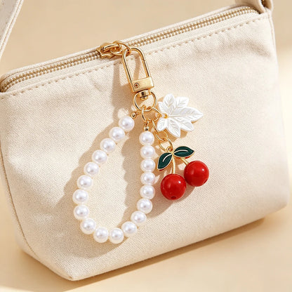Elegant Imitation Pearl Wrist Phone Lanyard with Cherry Pendant Cute Bow Leaf Keychain Bag Charm Anti-lost Phone Strap for Women
