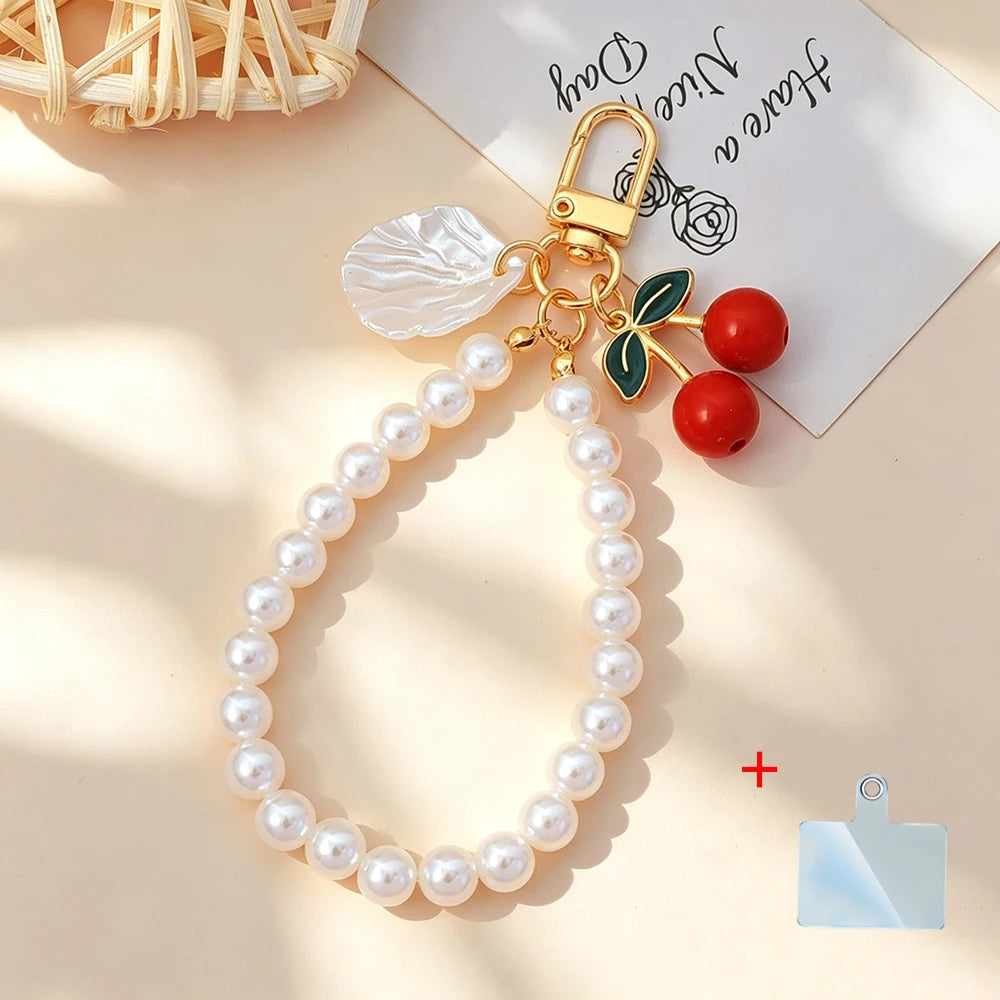 Elegant Imitation Pearl Wrist Phone Lanyard with Cherry Pendant Cute Bow Leaf Keychain Bag Charm Anti-lost Phone Strap for Women